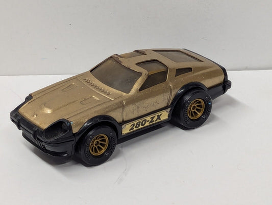 VINTAGE BUDDY L DATSUN 280-ZX GOLD AND BLACK 5" LONG